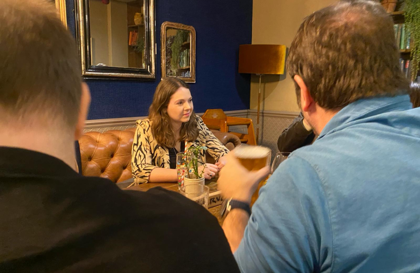 Laura at the pub listening to residents