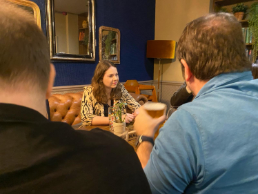 Laura at the pub listening to residents